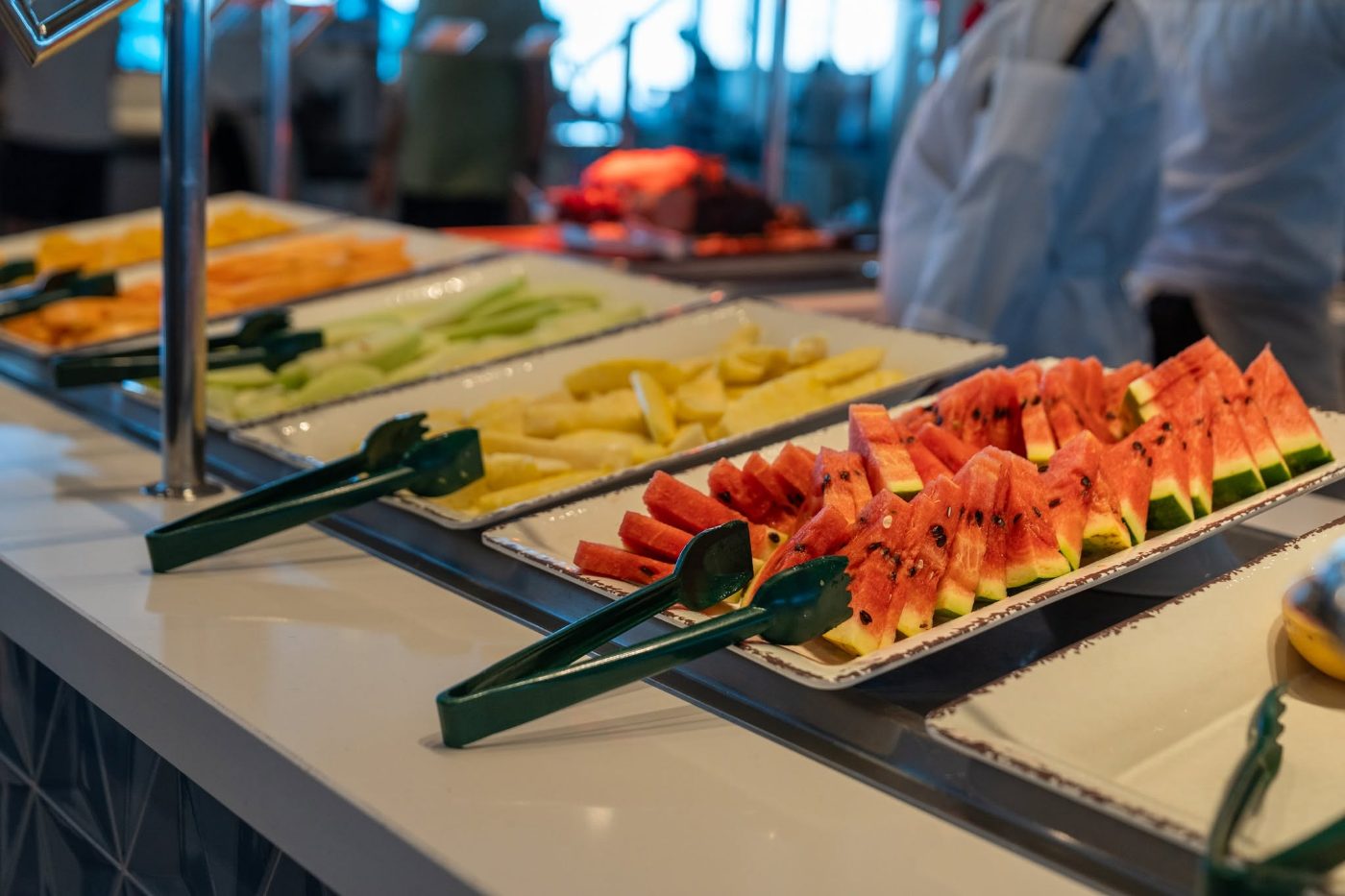 Fresh fruit laid out on the buffet at breakfast Fresh fruit laid out on the buffet at breakfast