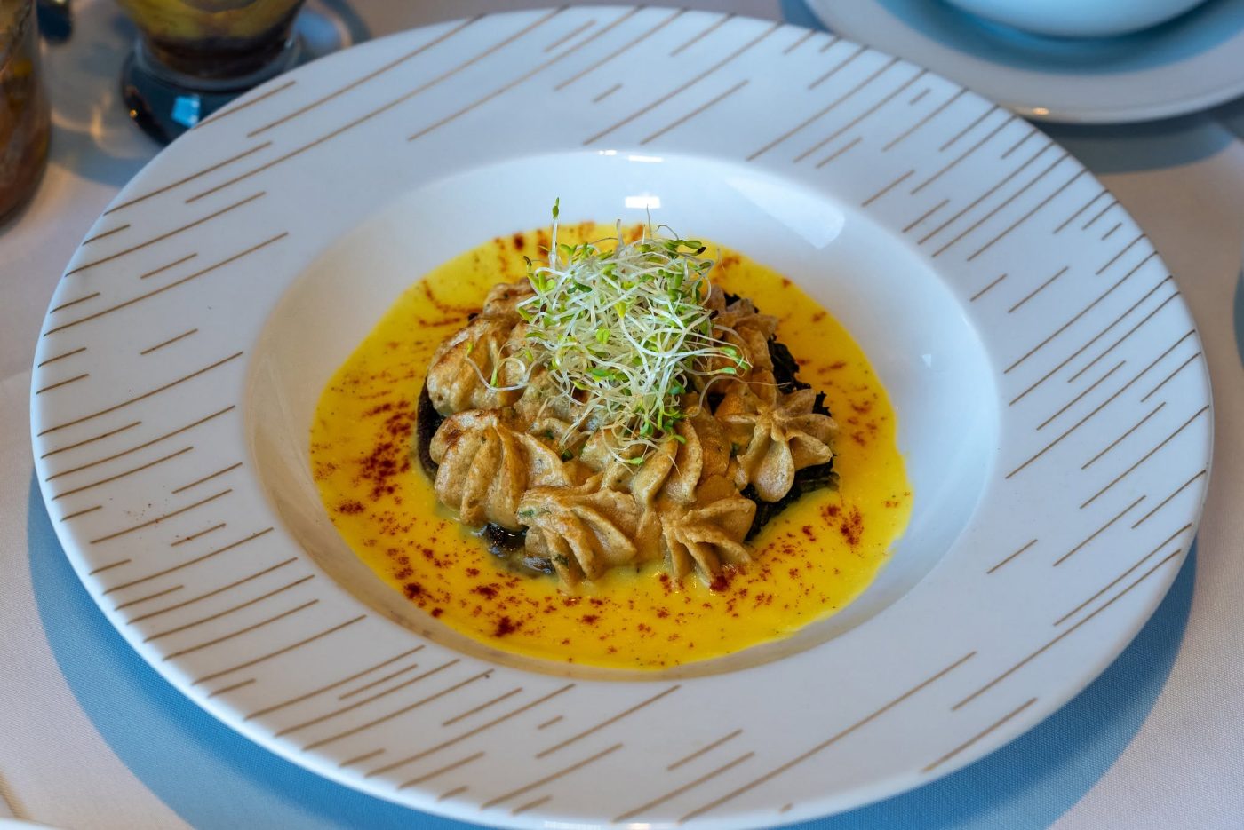 Dumplings served in a saffron broth Dumplings served in a saffron broth