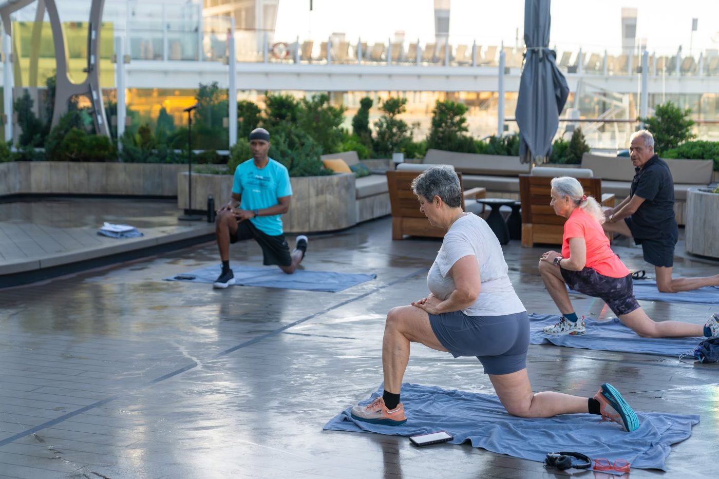 Guests in a morning movement session on the open deck Guests in a morning movement session on the open deck