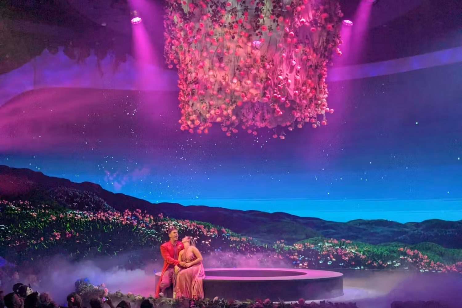 A lone figure at a writing desk as the words The mirror are projected across the LED wall in Between Takes A lone figure at a writing desk as the words The mirror are projected across the LED wall in Between Takes