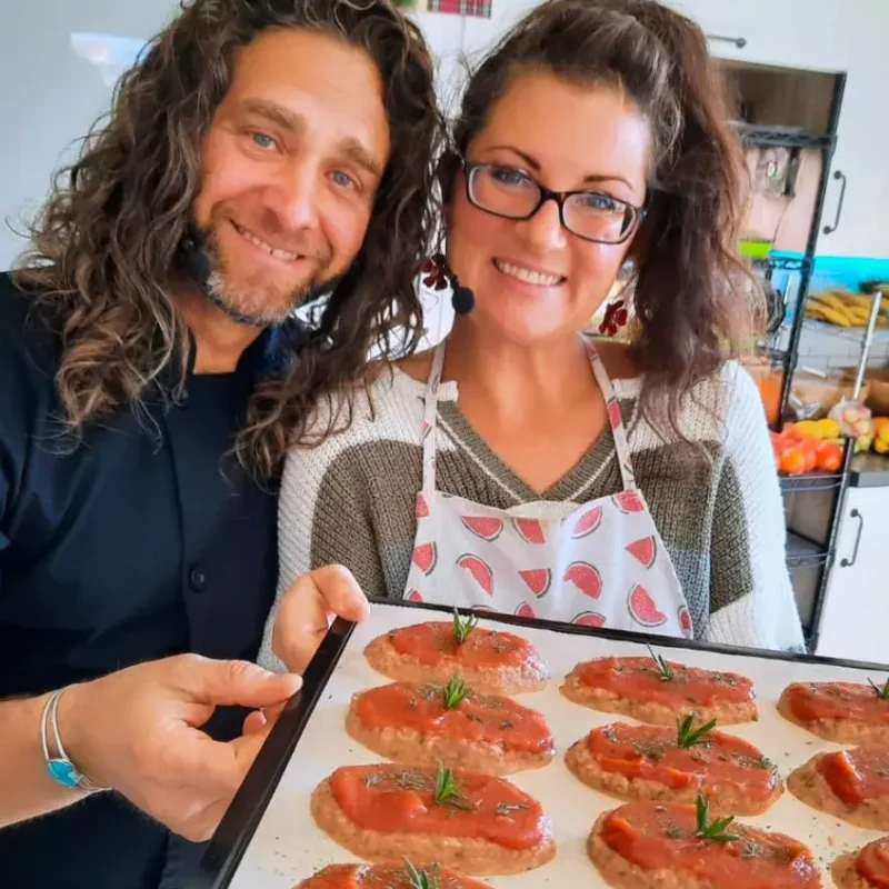 Lissa and Nate Maris, raw vegan educators, with a tray of prepared food Lissa and Nate Maris, raw vegan educators, with a tray of prepared food